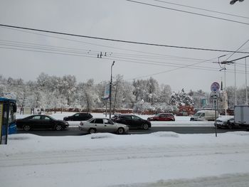 Cars on street in city during winter