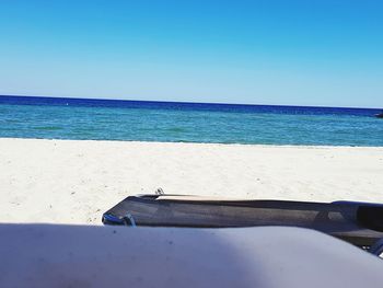 Scenic view of sea against clear blue sky