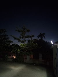 Illuminated building against sky at night