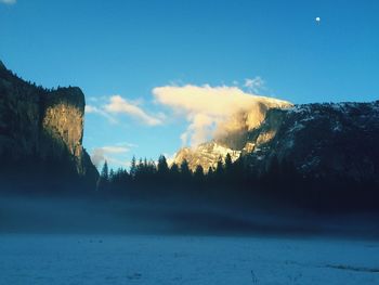 Scenic view of mountains against sky during winter