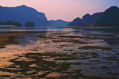 Scenic view of lake against sky during sunset