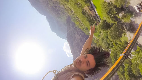 Low angle view of man on mountain against sky