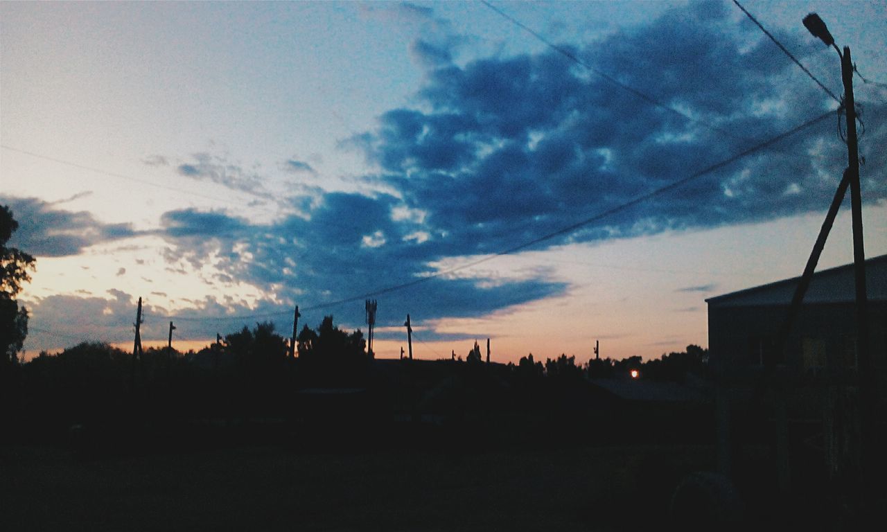 sky, power line, electricity pylon, cloud - sky, silhouette, electricity, power supply, cable, cloudy, sunset, fuel and power generation, cloud, built structure, connection, low angle view, landscape, dusk, building exterior, architecture, nature