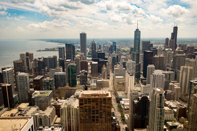 High angle view of cityscape against cloudy sky