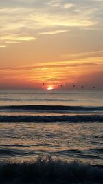 Scenic view of sea at sunset