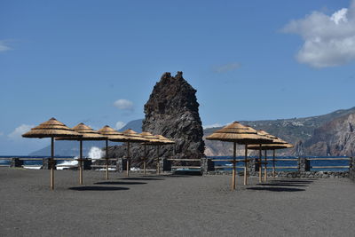Vulcano island, black beach front of a rock cliff. aeolian islands, sicily, italy