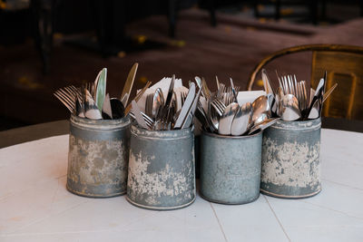 High angle view of paintbrushes in container on table