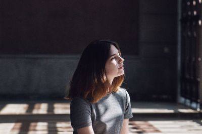 Close-up of young woman sitting at home