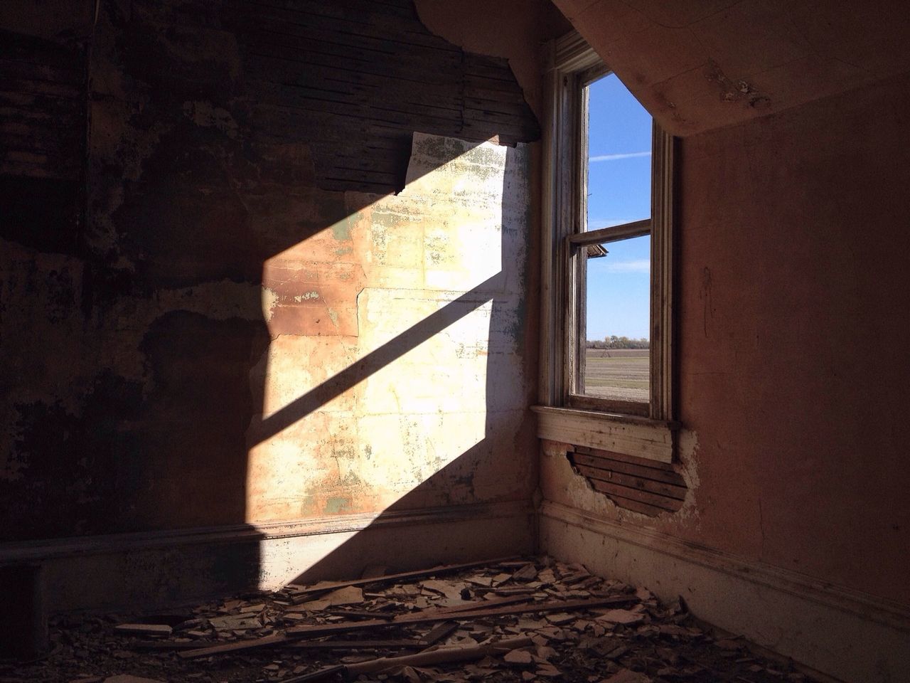 indoors, architecture, built structure, abandoned, window, wall - building feature, interior, old, damaged, home interior, sunlight, obsolete, run-down, deterioration, wall, no people, building, house, day, absence