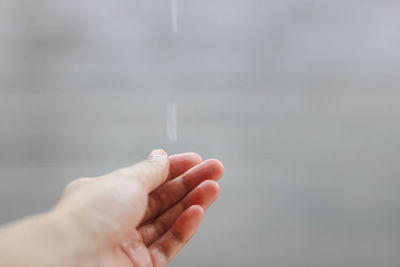 Close-up of hand holding water