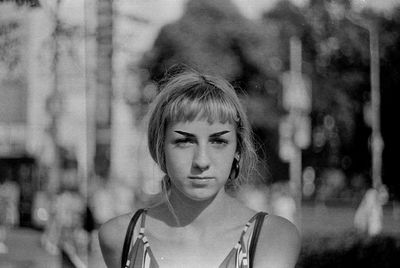 Portrait of woman standing outdoors