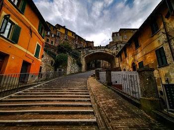 Street amidst buildings against sky