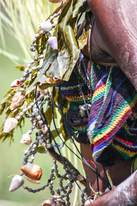 Midsection of woman in traditional clothing and jewelry