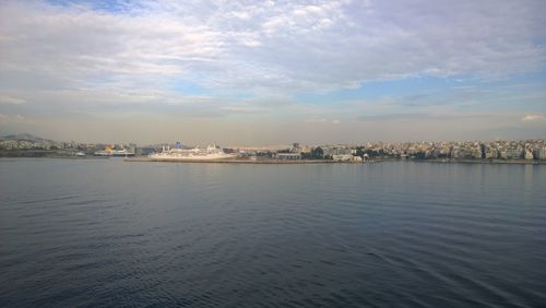 Scenic view of sea and buildings against sky