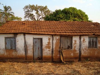 Exterior of old house on field