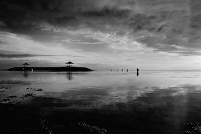 Scenic view of sea against cloudy sky