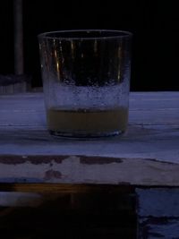 Close-up of beer glass on table