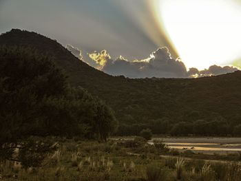 Scenic view of landscape against sky during sunset