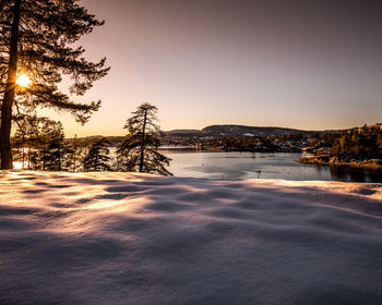 Scenic view of sea against clear sky during winter