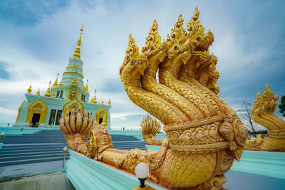 Statue of temple against building