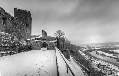 Panoramic view of old building against sky during winter