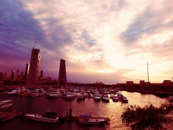 Boats in river with buildings in background