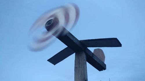 Close up of windmill against sky