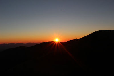 Scenic view of mountains at sunset