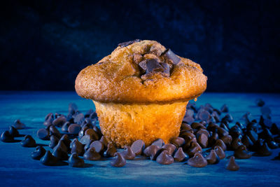 Close-up of muffin with chocolate chips on table