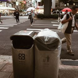 People walking on street in city