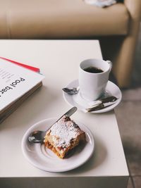 Coffee and cup on table