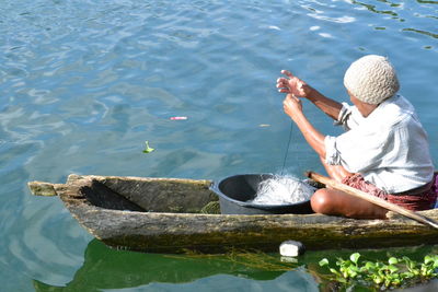 Fisherman on rustic boat in bali
