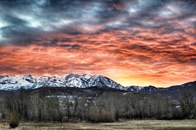 Scenic view of snowcapped mountains during sunset