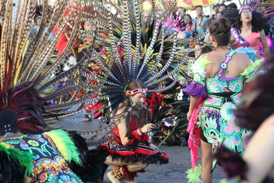 Rear view of people dancing in traditional clothing