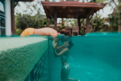 Man swimming in pool