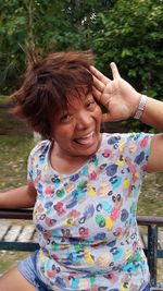 Portrait of a smiling girl sitting outdoors