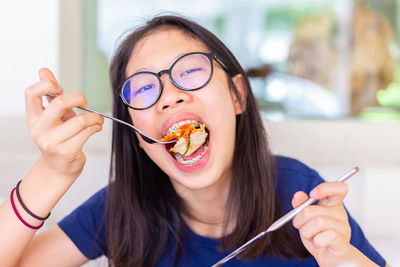 Portrait of woman eating ice cream