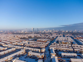 High angle view of townscape against clear blue sky