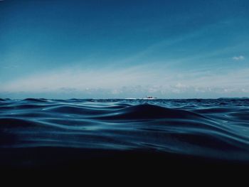 Scenic view of sea against blue sky