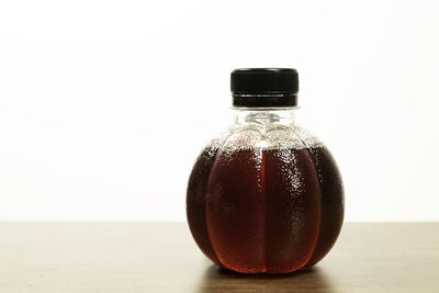 Close-up of glass bottle on table