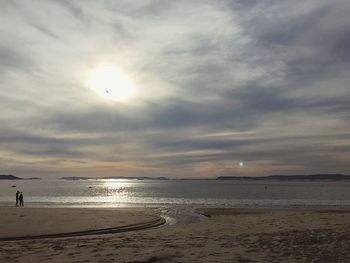 Scenic view of sea against cloudy sky