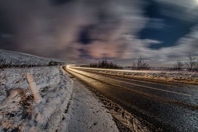 View of road on snow covered landscape