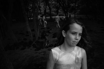 Portrait of teenage girl in forest