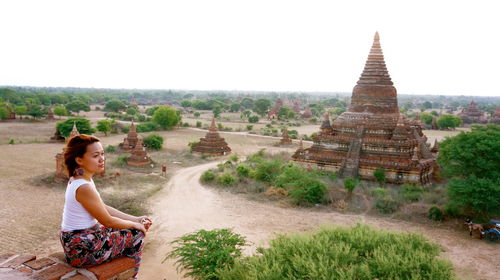 Woman sitting at temple