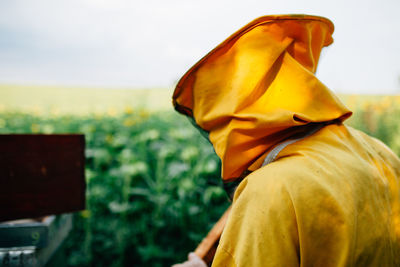 Close-up of beekeeper at farm