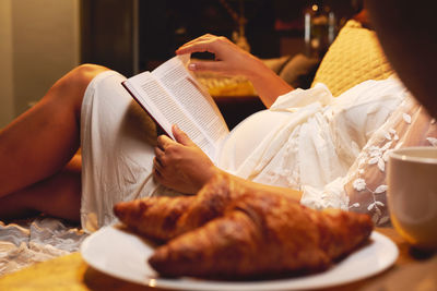 Midsection of woman holding food