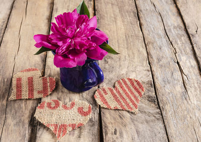 High angle view of pink flower on table