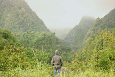 Lonely person contemplating the mountains