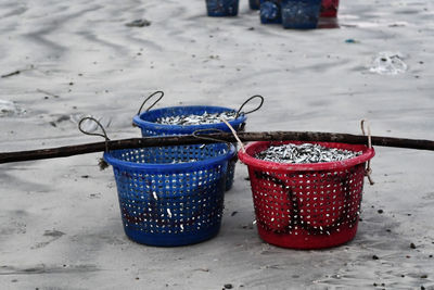 Close-up of red chili peppers in basket on table