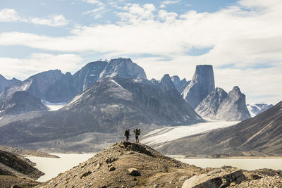 Scenic view of mountains against cloudy sky